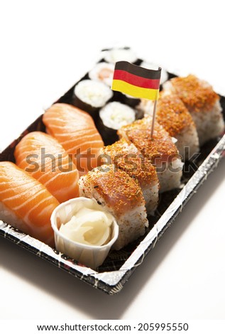 Sushi food on tray with German flag against white background