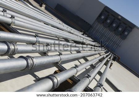 Pipes leading to electrical boxes at solar power plant