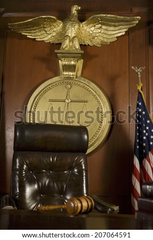 Gavel near judges chair in court room
