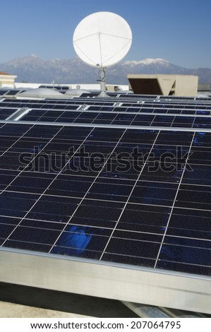 Solar panels and satellite dish at solar power plant