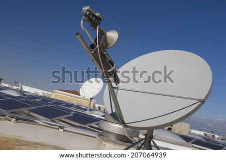 Satellite Dish with Solar Panels at Solar Power Plant