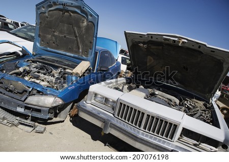 Damaged cars in junkyard