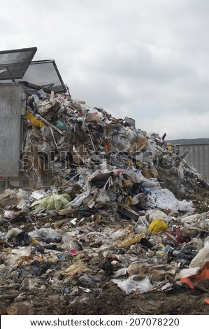 Truck dumping waste at landfill site