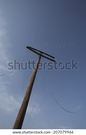 Telephone with cut cables, low angle view