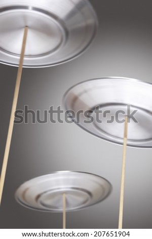 Plates Spinning on Sticks