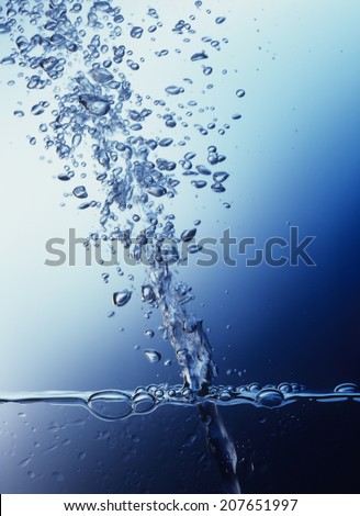 Air Bubbles Shooting Upward Through Water