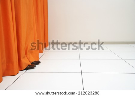 Feet Behind Curtain