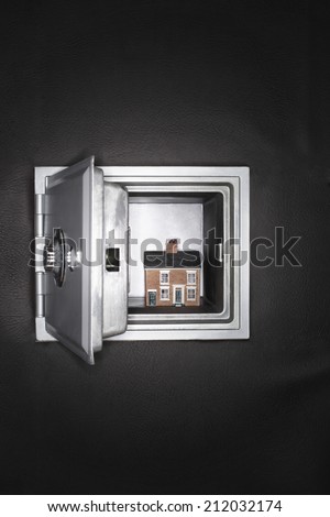 Ceramic house in opened safe