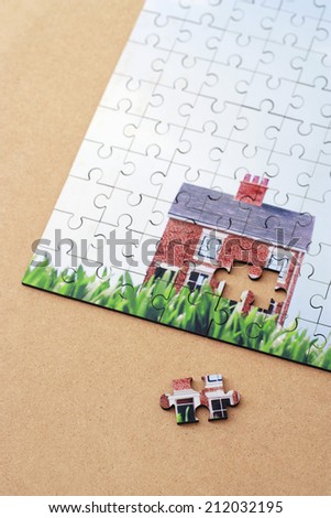 Jigsaw puzzle with house, elevated view