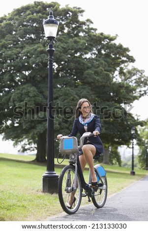 Young businesswoman commuting by her bicycle