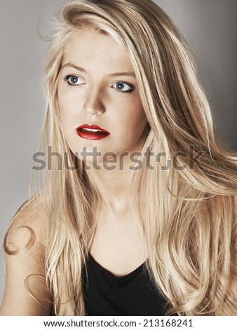 Head shot of pretty young woman looking off camera