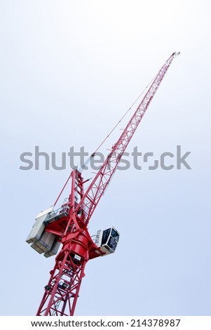 Close-up view of a red crane against sky