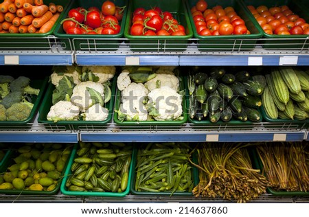 Variety of fresh vegetables on display in grocery store