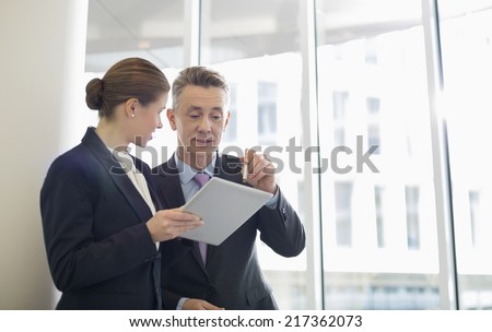 Business people using tablet PC in office