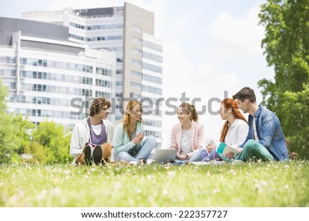 University students studying together on campus ground