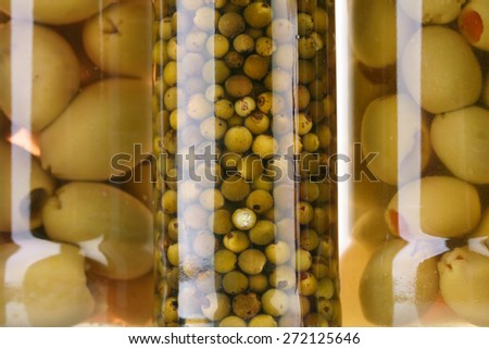 Close up of pickled olives in jar