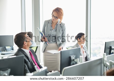 Business people working in an open plan office