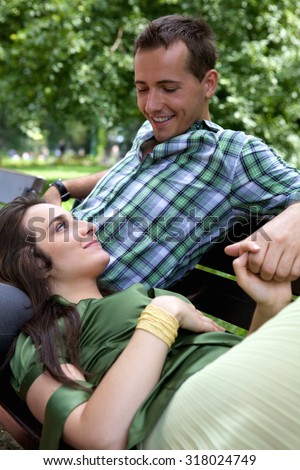 Girlfriend resting head on boyfriend\'s lap