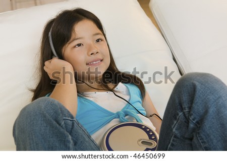 Girl Listening to Music on CD Player