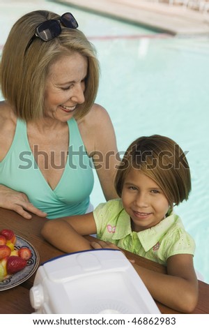 Girl and Grandmother at the Pool