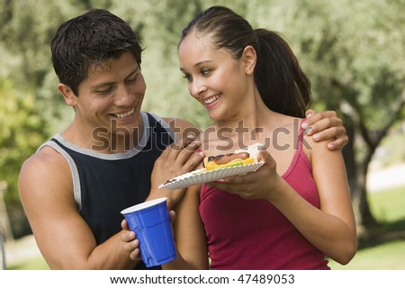 Couple Sharing Food at Picnic