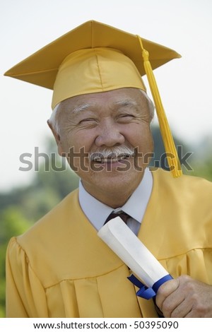 Senior Graduate holding diploma outside, portrait
