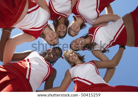 Cheerleaders in Huddle, view from below, (view from below)