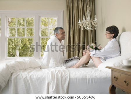 Couple enjoying lazy morning in bed