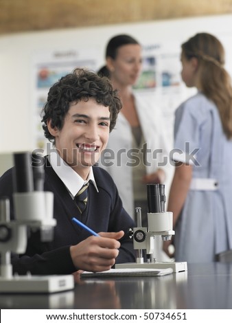 High school student sitting at desk in chemistry class, portrait