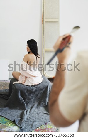 Woman Model Posing For Artist In Studio, Back View Stock Photo Woman Model Posing For Artist In Studio, Back View Stock Photo