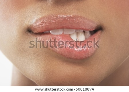 Woman biting lip