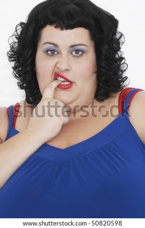 Overweight Woman Curling Lip and biting finger, portrait
