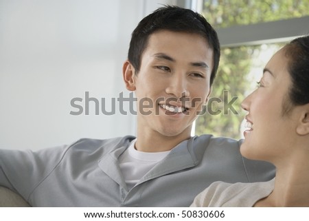 Couple Relaxing Together, looking in each other\'s eyes