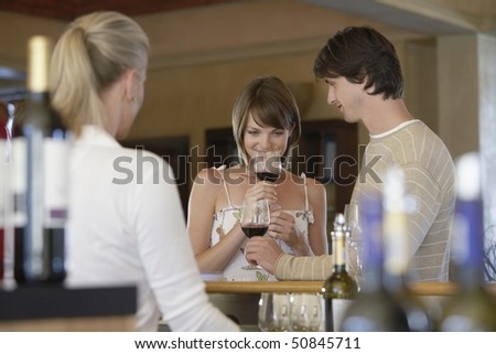 Man and woman wine-tasting, selective focus