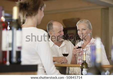 Man and woman wine-tasting, selective focus
