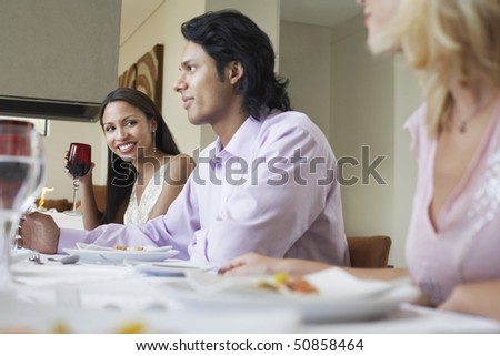 Friends sitting together at Dinner Party