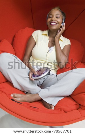 Woman Listening to Music in Chair