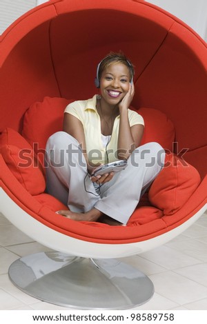Woman Listening to Music in Chair
