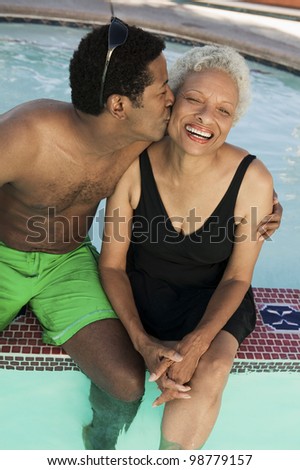 Son Kissing Mother Poolside