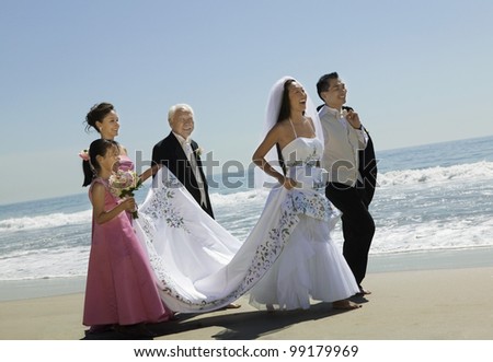 Bride and Groom With Family on Beach