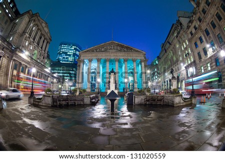 Night View Of British Financial Heart, Bank Of England And Royal Exchange. The Photo Was Taken At A Slow Shutter Speed Wide-Angle Fisheye Lens