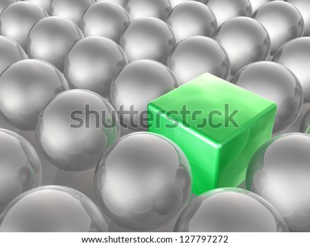 Green cube and grey spheres as abstract background.