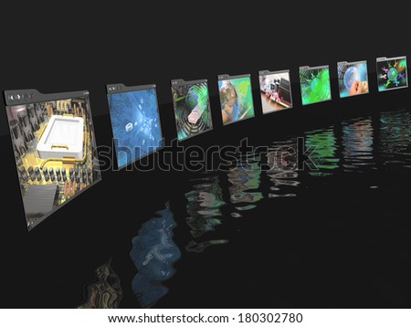 Web pages with pictures (computer) on black reflective background.