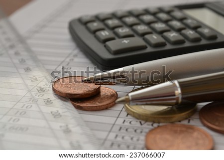 Business background with money, calculator and pen.