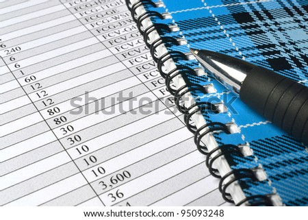 Business background with table, pen and notepad.