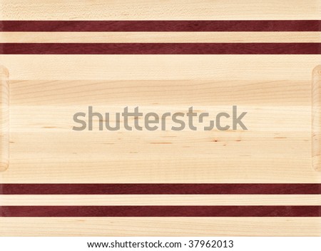 Wood cutting board with different color wood strips.