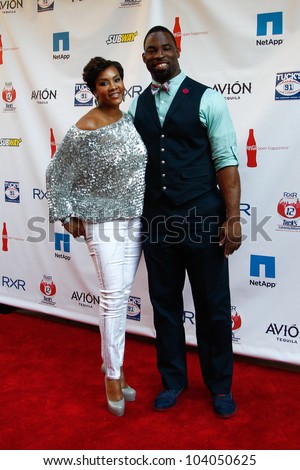 NEW YORK-MAY 31: Actress Vivica A. Fox and New York Giants player Justin Tuck attend the 4th annual TuckÃ¢Â?Â?s Celebrity Billiards Tournament at Slate on May 31, 2012 in New York City.