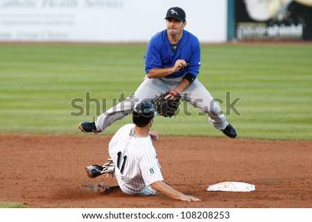 CENTRAL ISLIP-JULY 21: Long Island Ducks infielder Shawn Williams (11) is forced out by Sugar Land Skeeters infielder Dominic Ramos (4) on July 21, 2012 at Bethpage Park in Central Islip, New York.
