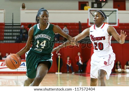 NEW YORK-NOV 3: Farmingdale Rams guard Siohban Purvis dribbles past St. John\'s Red Storm guard Keylantra Langley (20) at Carnesecca Arena on November 3, 2012 in Jamaica, Queens, New York.