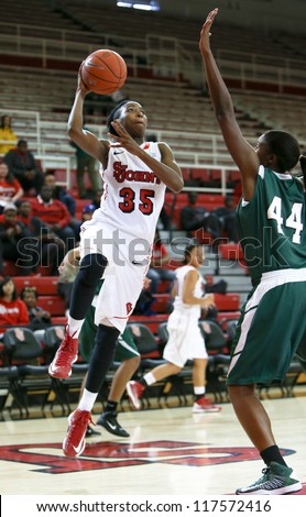 NEW YORK-NOV 3: St. John\'s Red Storm guard Shenneika Smith (35) shoots over Farmingdale Rams center Wabiyn Ati (44) at Carnesecca Arena on November 3, 2012 in Jamaica, Queens, New York.